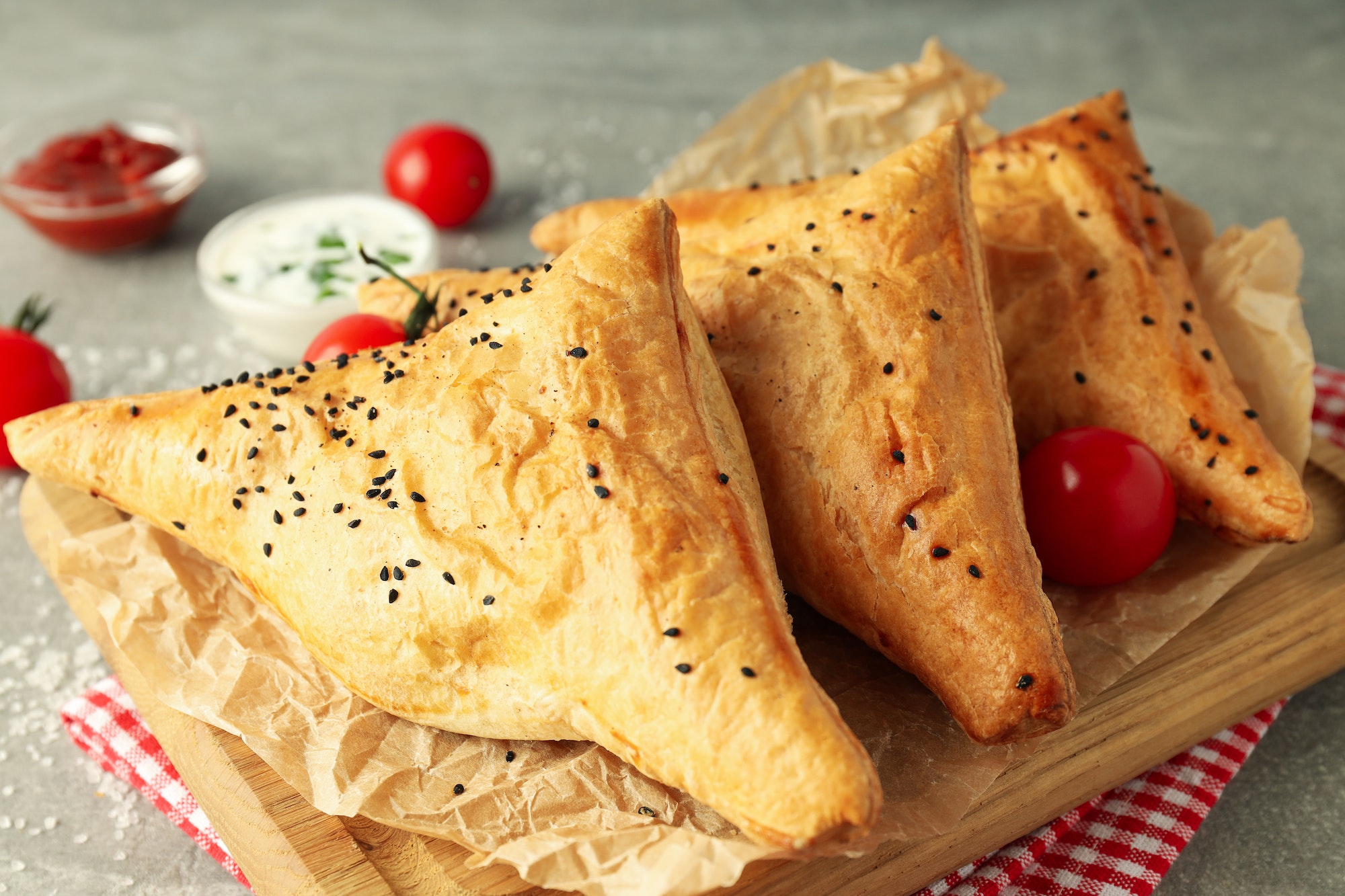 Concept of tasty food with samsa on gray background